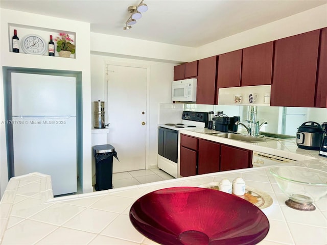 kitchen with sink and white appliances