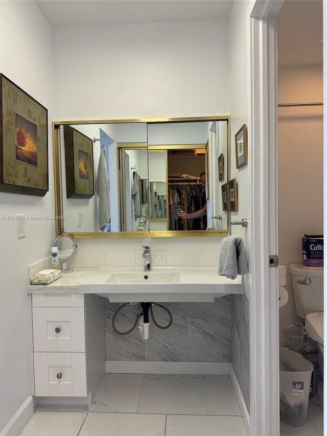 bathroom with toilet and sink