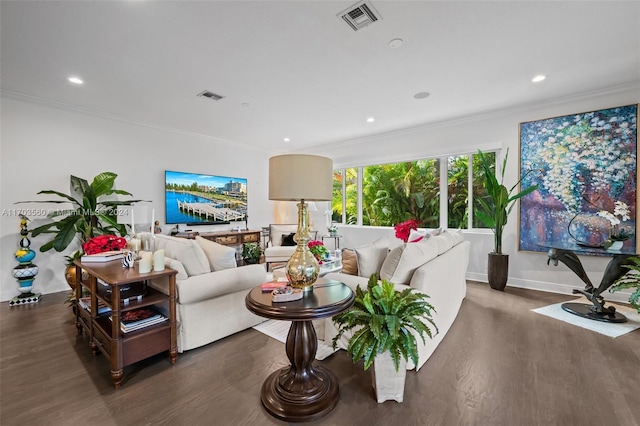 living room with ornamental molding and dark wood-type flooring