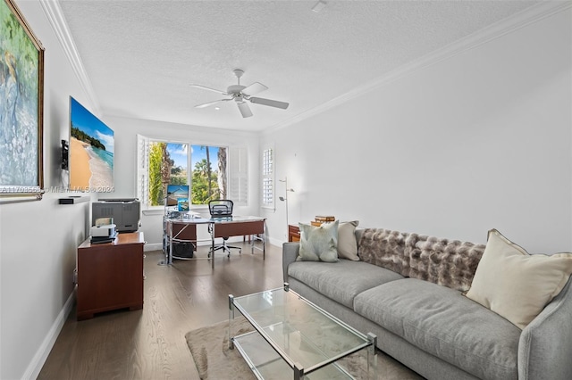 living room with a textured ceiling, ceiling fan, ornamental molding, and dark wood-type flooring