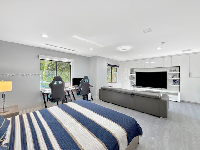 bedroom with recessed lighting, baseboards, visible vents, and light wood finished floors
