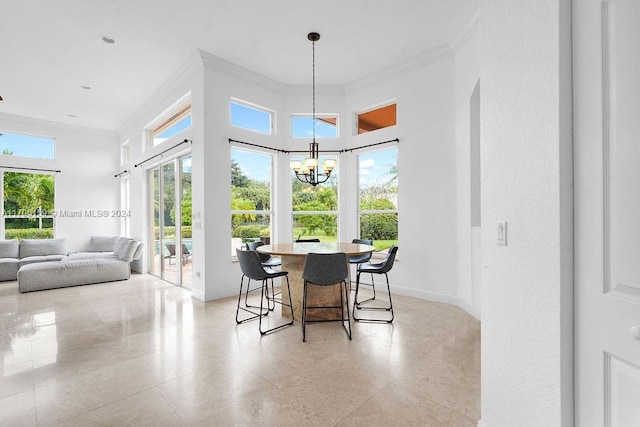 dining area with a notable chandelier and ornamental molding