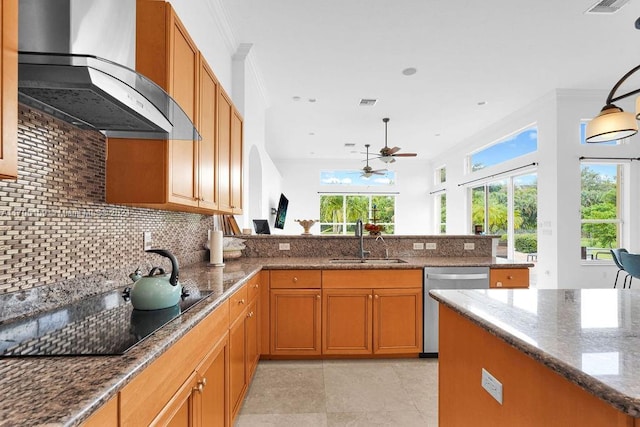 kitchen featuring sink, wall chimney range hood, stainless steel dishwasher, black electric stovetop, and ornamental molding