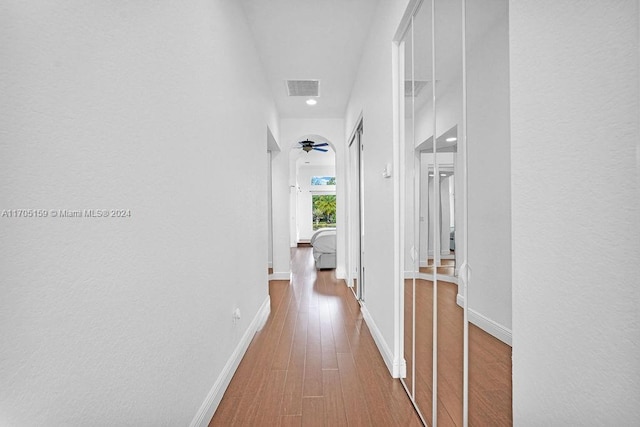 hallway featuring hardwood / wood-style flooring