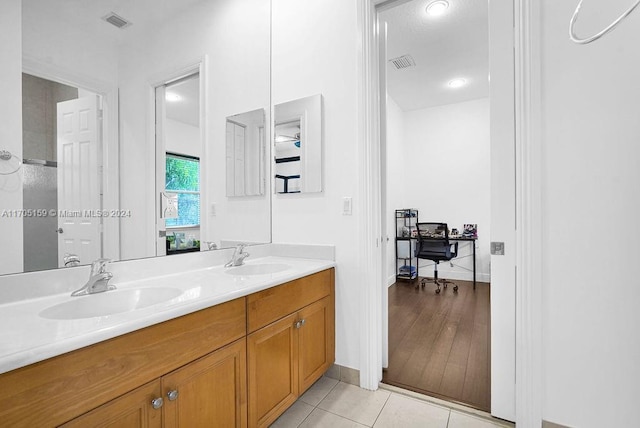 bathroom with vanity and hardwood / wood-style flooring