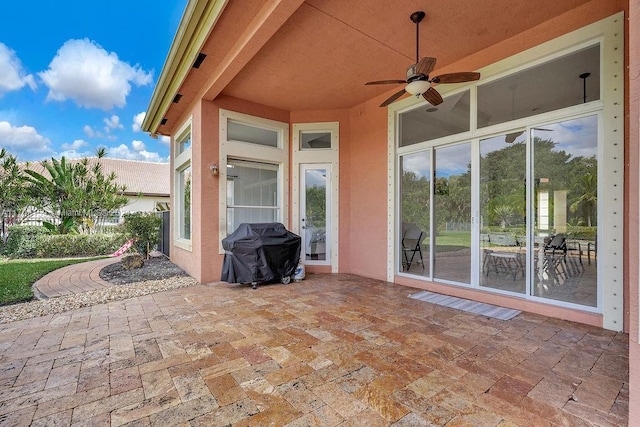 view of patio / terrace featuring ceiling fan and grilling area