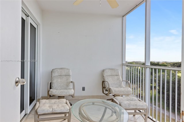 sunroom / solarium with plenty of natural light and ceiling fan