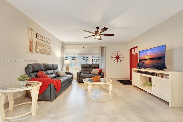 living room with ceiling fan and light tile patterned floors