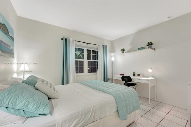 bedroom featuring light tile patterned flooring