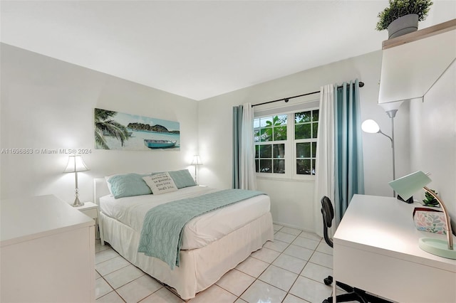 bedroom with light tile patterned floors