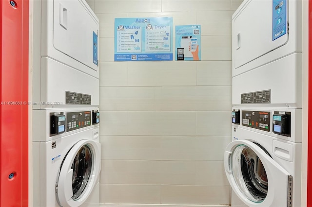 laundry room with stacked washer / dryer