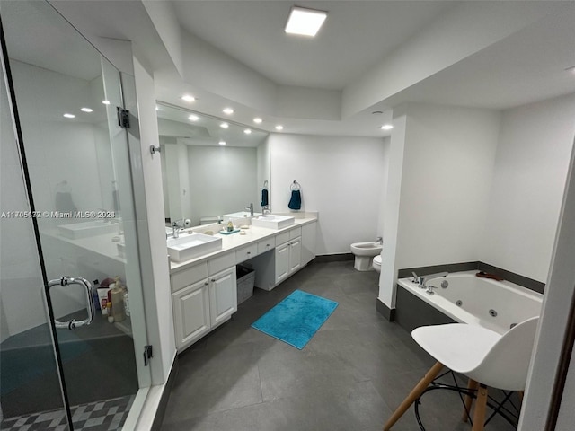 full bathroom featuring vanity, separate shower and tub, toilet, and a bidet