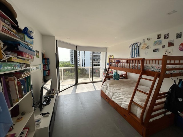 bedroom with access to exterior and floor to ceiling windows