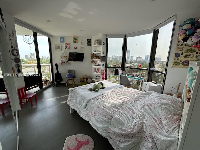 bedroom featuring floor to ceiling windows