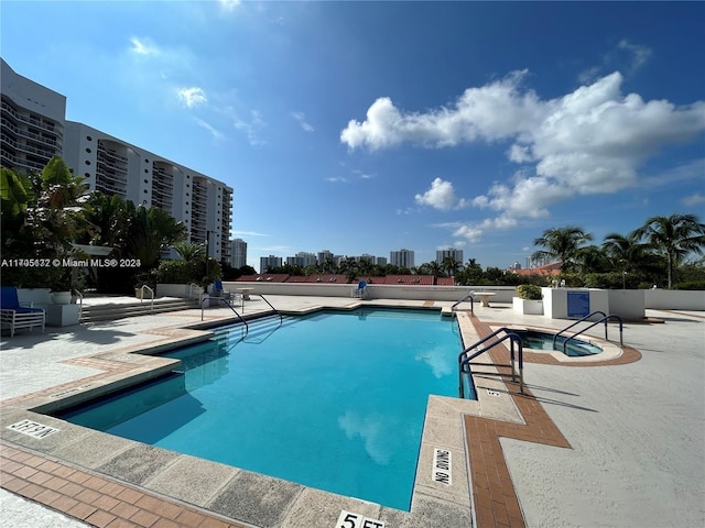 view of pool featuring a patio