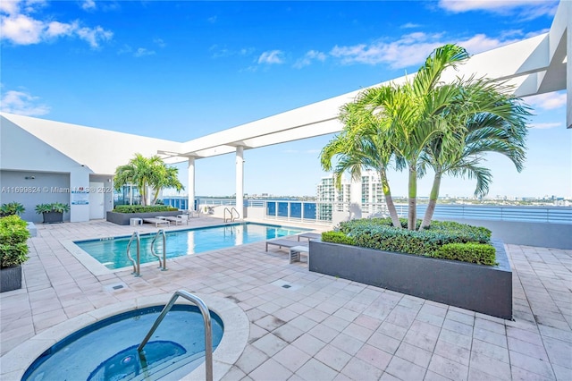 view of swimming pool with a community hot tub and a patio