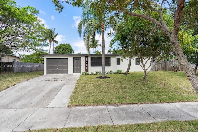 single story home with a front lawn and a garage