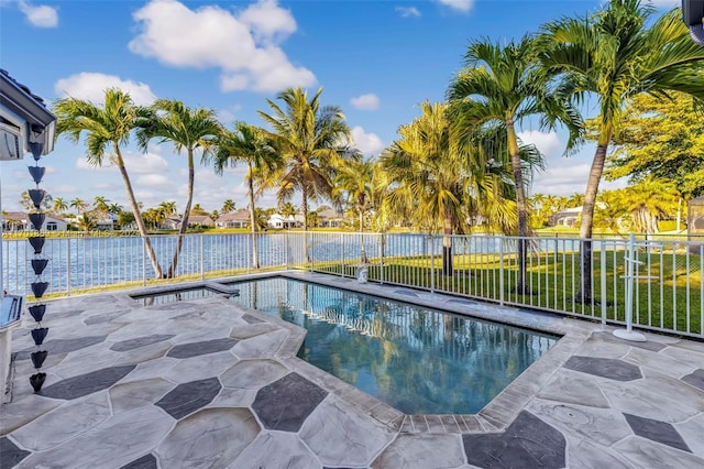 view of pool with a jacuzzi, a water view, and a patio