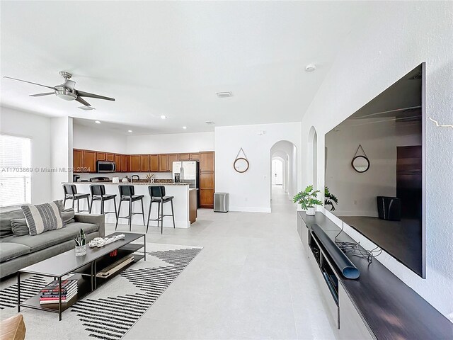 living room featuring ceiling fan