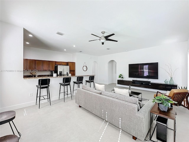 living room featuring ceiling fan