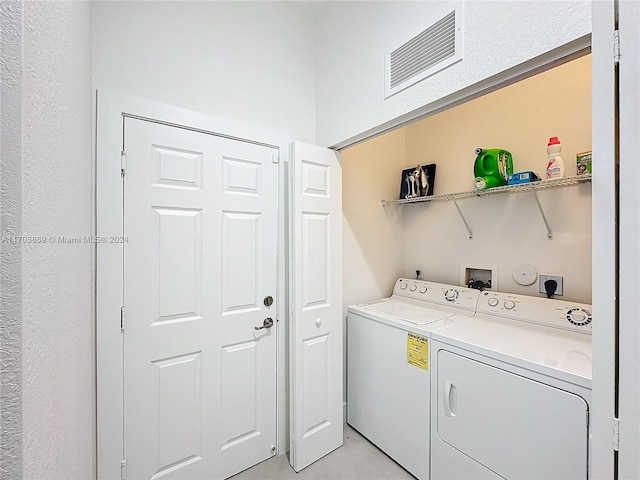 laundry room featuring separate washer and dryer