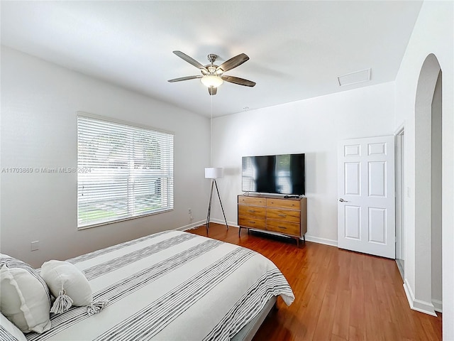 bedroom with hardwood / wood-style floors and ceiling fan