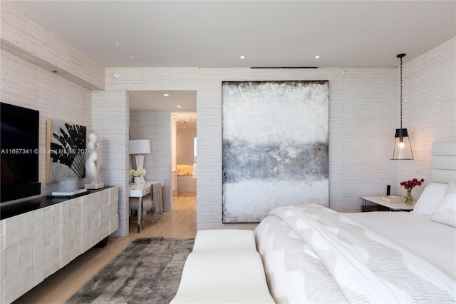 bedroom with wood-type flooring