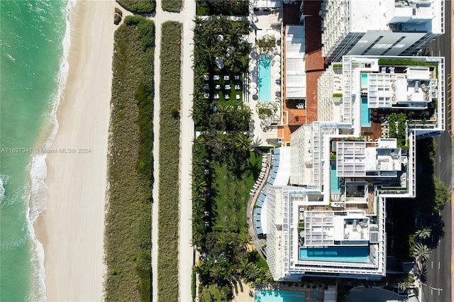 aerial view featuring a view of the beach and a water view