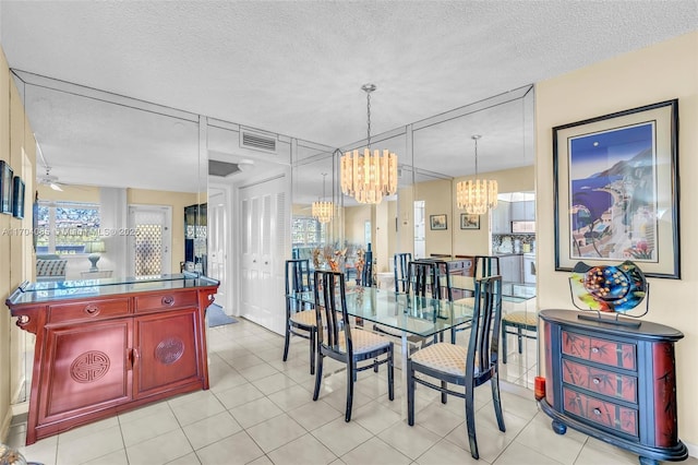 3029 Berkshire B 3029, Deerfield Beach, FL 33442 - dining space featuring a textured ceiling, plenty of natural light, visible vents, and an inviting chandelier