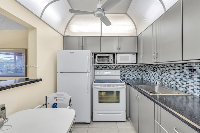 kitchen with ceiling fan, gray cabinets, white appliances, and sink