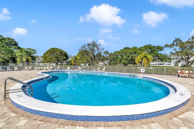 view of swimming pool featuring a patio area