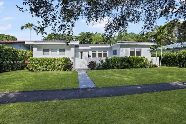 ranch-style home with a front yard