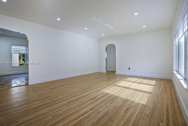 spare room with light wood-type flooring