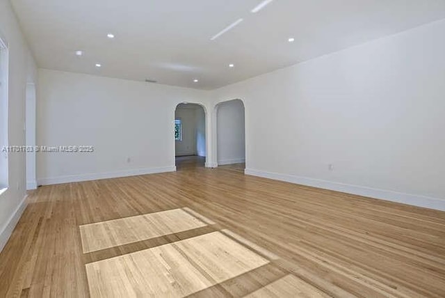 spare room with light wood-type flooring