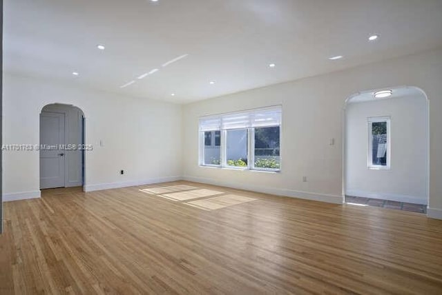 spare room featuring light hardwood / wood-style flooring