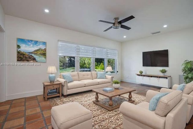 tiled living room featuring ceiling fan