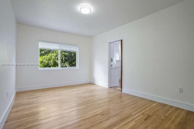 empty room with light wood-type flooring