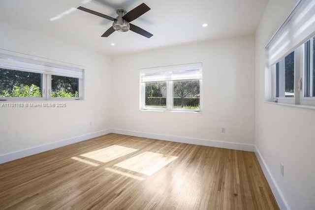 unfurnished room with hardwood / wood-style floors and ceiling fan