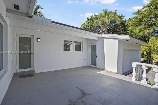 view of patio with a garage