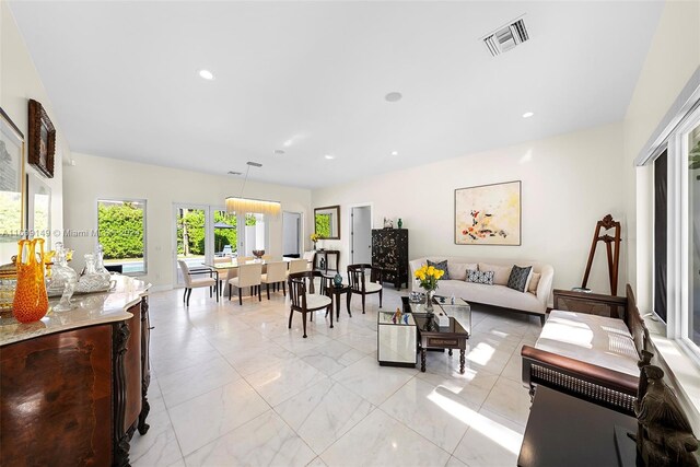 511 Madeira Ave, Coral Gables, FL 33134 - living area with light marble finish floors and recessed lighting