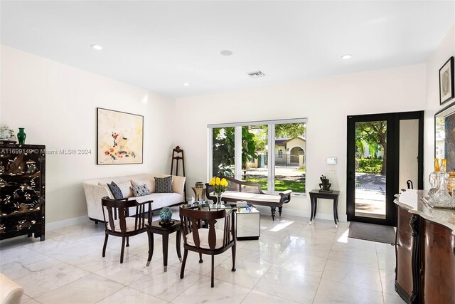 511 Madeira Ave, Coral Gables, FL 33134 - living area featuring baseboards, light marble finish flooring, and recessed lighting