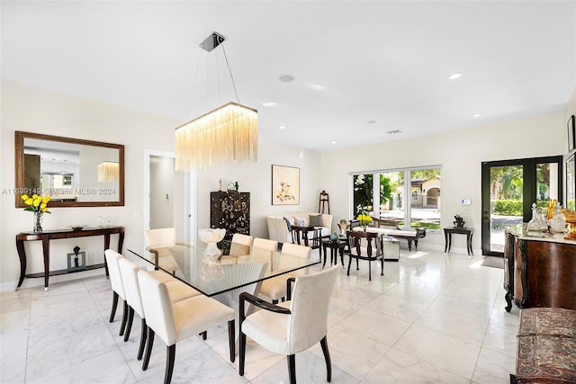 dining space featuring french doors