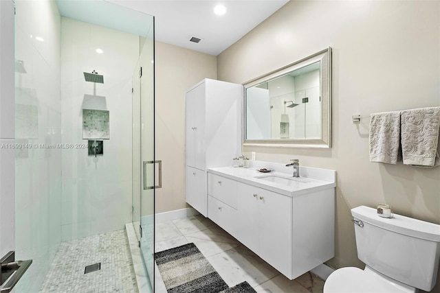 bathroom featuring vanity, toilet, and walk in shower