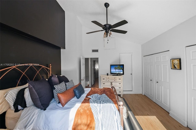 bedroom featuring light wood-type flooring, ceiling fan, and lofted ceiling