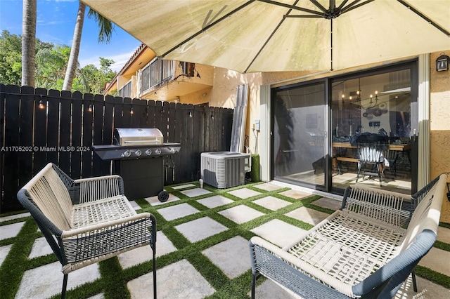 view of patio / terrace featuring central AC unit and area for grilling