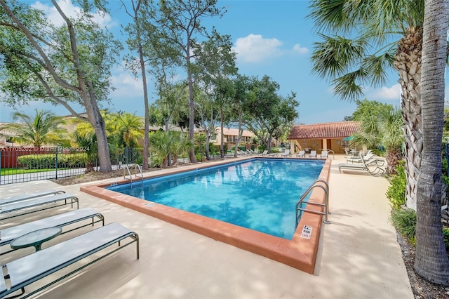 view of pool featuring a patio