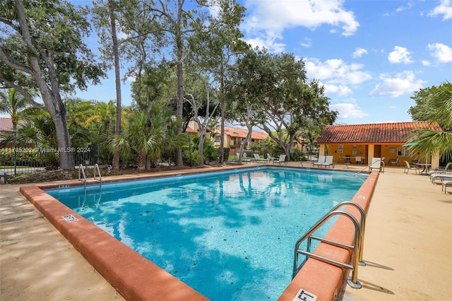 view of swimming pool with a patio