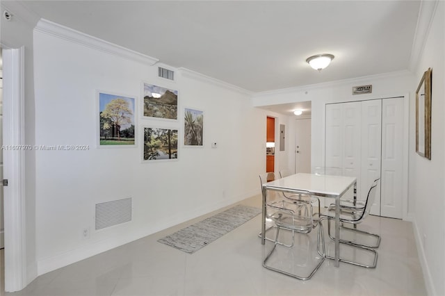 tiled dining area with ornamental molding