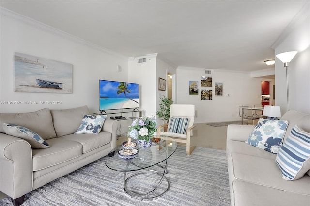 carpeted living room featuring crown molding