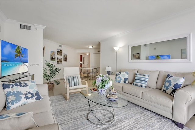 living room with ornamental molding